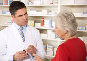 a pharmacist man and a customer