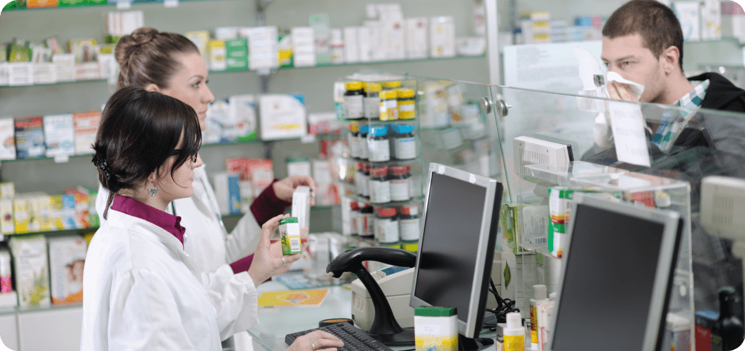 pharmacist assisting customer