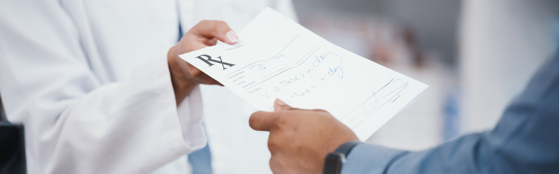 two people holding a rx receipt